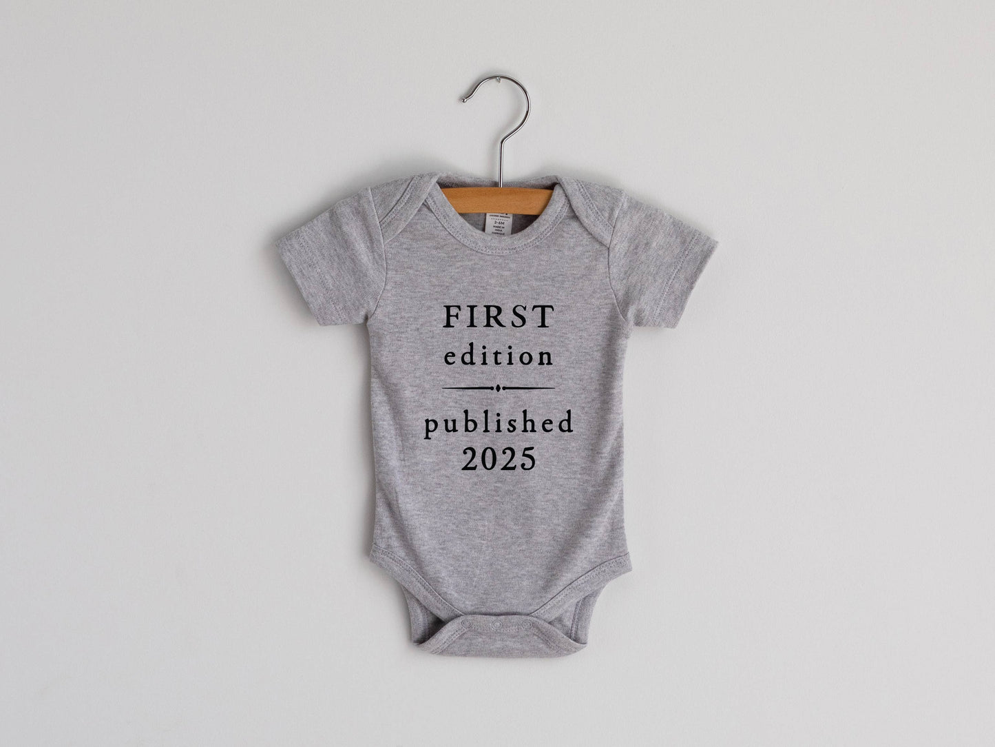 Gray First Edition 2025 Book Style Baby Bodysuit: 0-3 Months / Short Sleeve